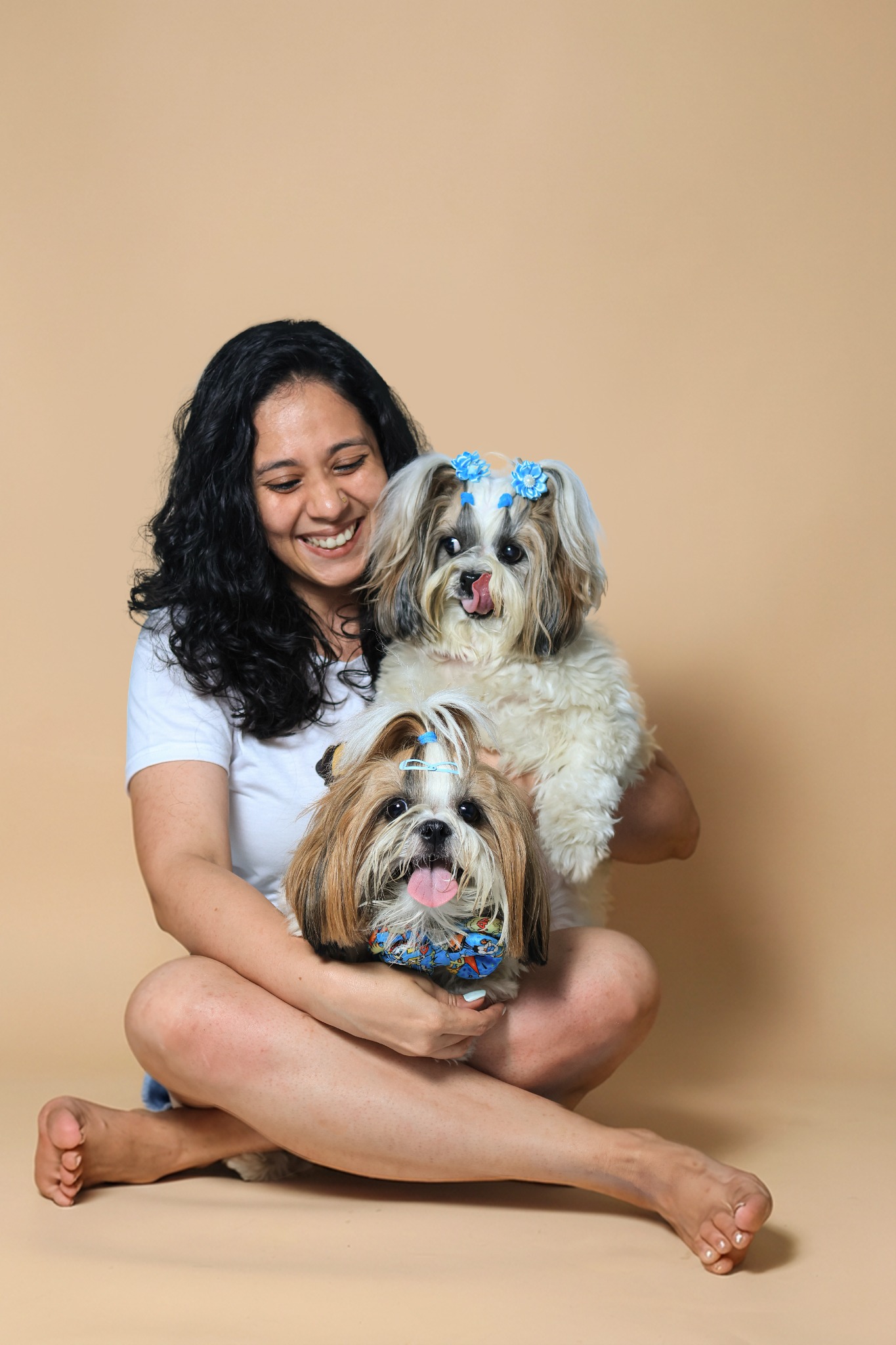 Parisha smiling with her Shih Tzus, June and J’adore